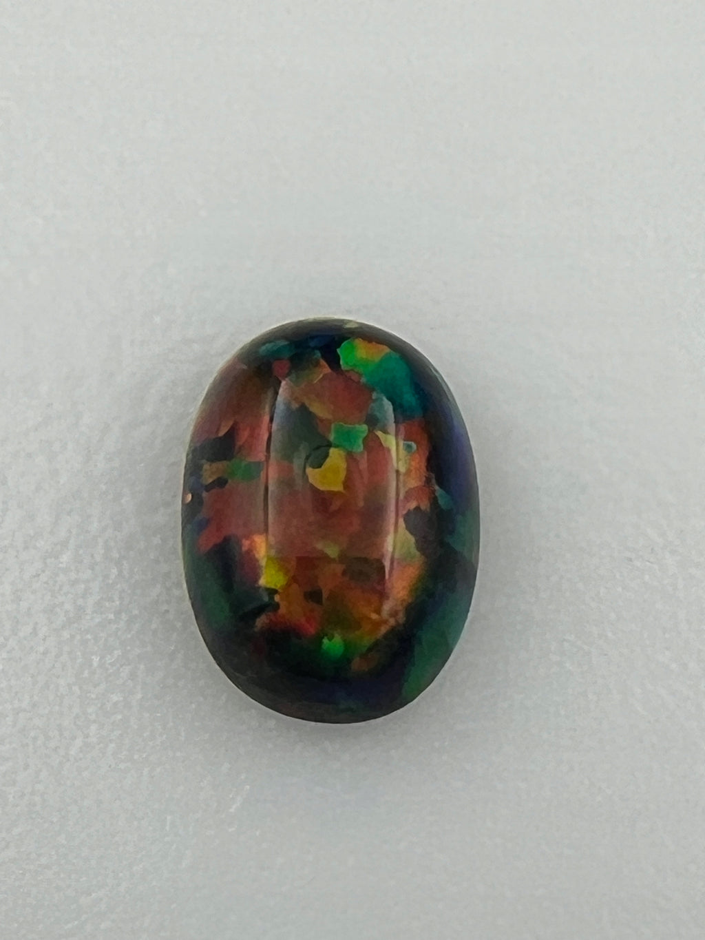 OPAL ARLEKIN KABOSZON CZARNY OWAL 7x5 mm