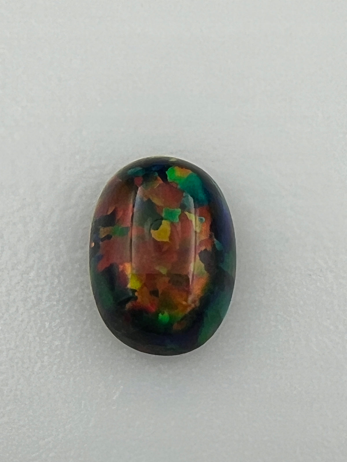 OPAL ARLEKIN KABOSZON CZARNY OWAL 7x5 mm