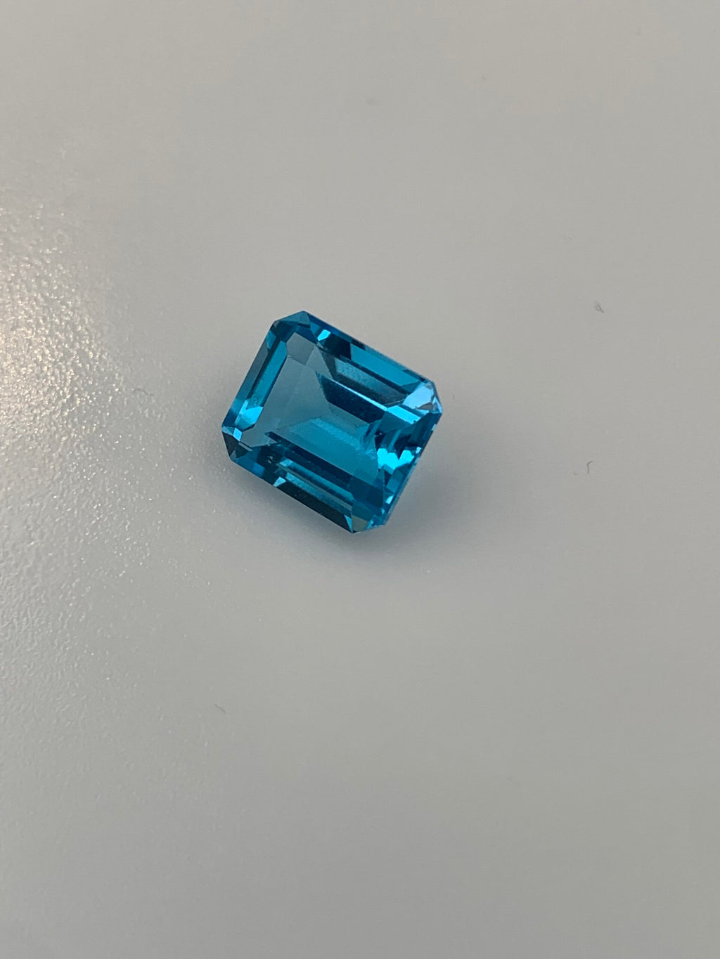 TOPAZ SWISS BLUE OŚMIOKĄT 12X10 mm